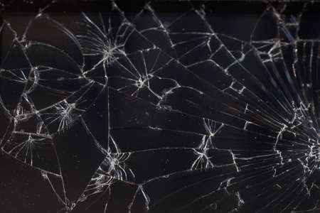 Texture from the broken phone screen. The smartphone with the burst glass.