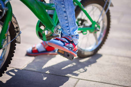 Bicycle pedal close up. The child is pedaling. Healthy lifestyle conceptの写真素材