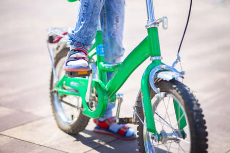 Bicycle pedal close up. The child is pedaling. Kids sportsの写真素材