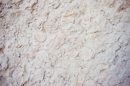 Abstract background of chaotically plastered cement on the wall. Cement pattern. Cement stucco molding on the walls of the buildingの写真素材
