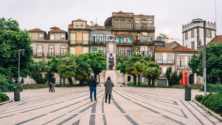 Quaint City Square with Historic Architecture and Vibrant Graffiti in Porto's Scenic Cityscapeの写真素材