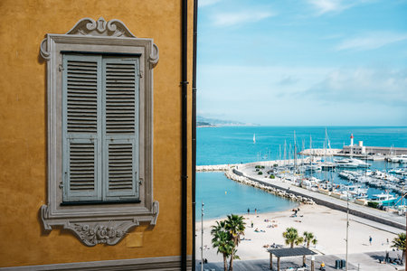 Charming Mediterranean Seaside View with Vibrant Shuttered Window and Scenic Marina Vista