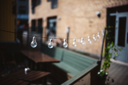 Charming Outdoor Patio with String Lights Creating a Cozy Ambient Atmosphere in Urban Setting