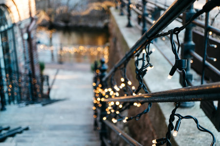Charming Walkway Adorned with Twinkling Fairy Lights Offering a Magical Outdoor Ambiance on Picturesque Evening Staircaseの写真素材
