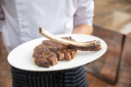 Grilled meat on the plate in a top restaurant