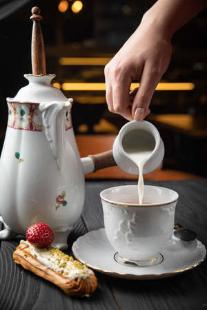 hot chocolate with eclair on a blackboard
