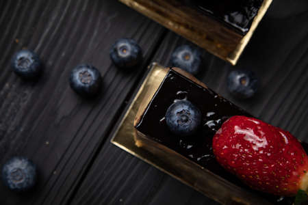 dessert with strawberries on a black backgroundの写真素材