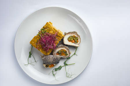 Healthy food on a white plate and a white background.