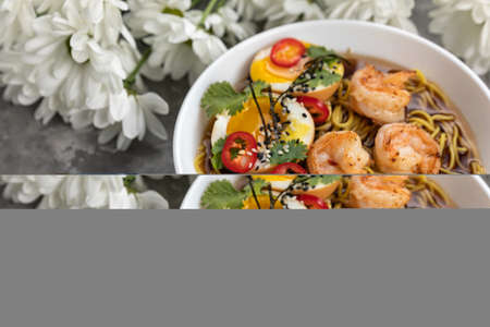 soup with seafood, noodles, eggs on a gray backgroundの写真素材