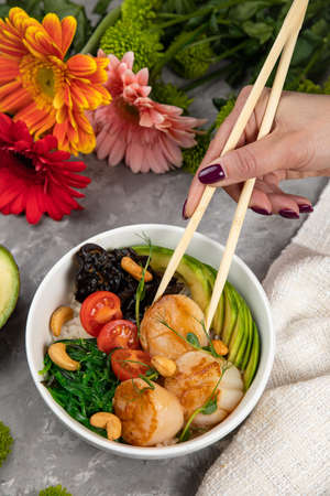 Traditional Hawaiian cuisine - poke on a gray background