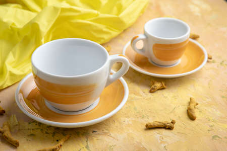 yellow coffee cup on yellow background