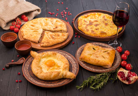 Hospitable Georgian cuisine. Set with delicious food on ethnic platesの写真素材