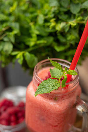 Cool smoothie with raspberries on a wooden backgroundの写真素材