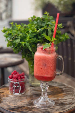 Cool smoothie with raspberries on a wooden backgroundの写真素材