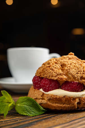 Fragrant French pastries, dessert. On a brown wooden table.の写真素材