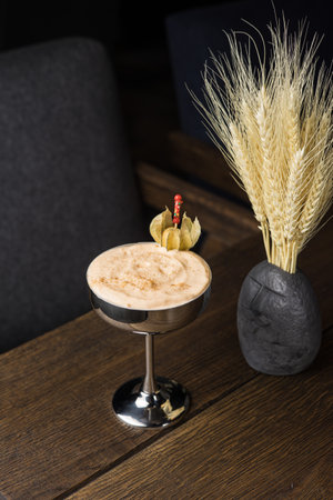 Coffee in a martini glass on a wooden table.の写真素材