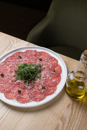 Raw beef carpaccio with arugula and parmesan cheeseの写真素材
