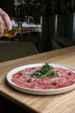 Beef carpaccio with arugula and parmesan cheeseの写真素材