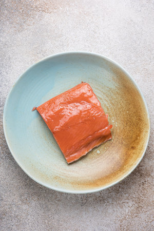 Sliced smoked salmon on ceramic plate, Japanese food style.の写真素材