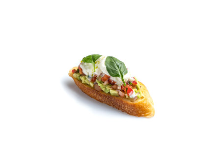 Open faced bruschetta with avocado and mozzarella isolated on white backgroundの写真素材