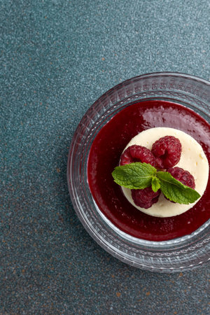 Panna cotta with fresh raspberries and mint. Selective focus.の写真素材