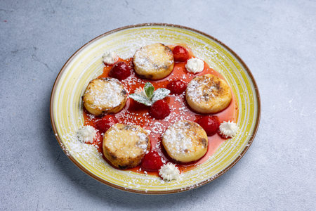 Cottage cheese pancakes with strawberries and mascarpone. Selective focus.