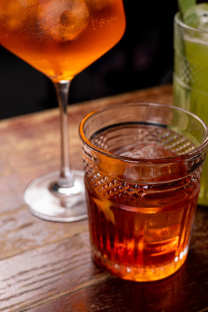 cocktail in the bar on a dark background. close-upの写真素材
