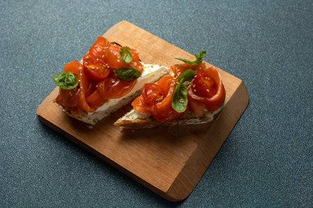 bruschetta with salted salmon, cream cheese and basilの写真素材