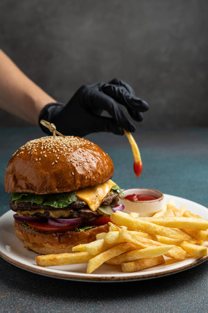 Cheese burger - American cheese burger with Golden French fries and sauce