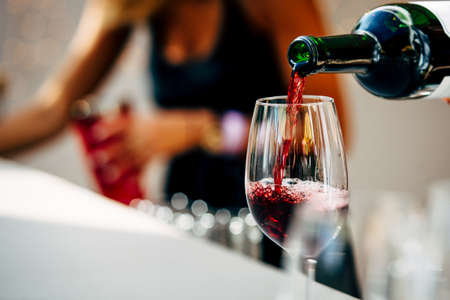 Pouring red wineの写真素材