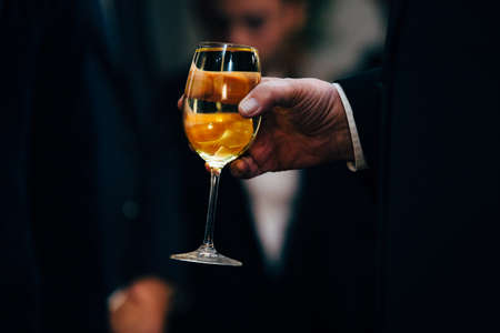 Man with a elegat dressing holding wine glass.の写真素材