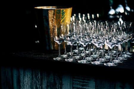 Luxury table settings for fine dining with and glassware, beautiful blurred  background. Preparation for holiday  Christmas and Hannukah dinner night.の写真素材