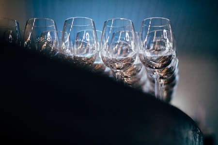 Luxury table settings for fine dining with and glassware, beautiful blurred  background. Preparation for holiday  Christmas and Hannukah dinner night.の写真素材