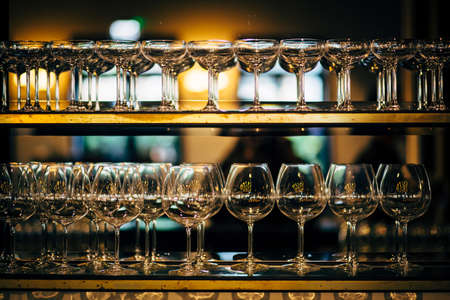 Luxury table settings for fine dining with and glassware, beautiful blurred  background. Preparation for holiday  Christmas and Hannukah dinner night.の写真素材