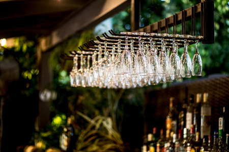 Luxury table settings for fine dining with and glassware, beautiful blurred  background. Preparation for holiday  Christmas and Hannukah dinner night.の写真素材