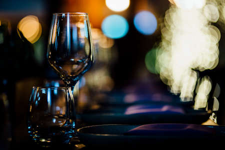 Luxury table settings for fine dining with and glassware, beautiful blurred  background. For events, weddings.の写真素材