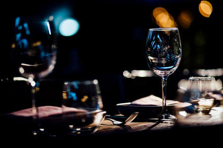 Luxury table settings for fine dining with and glassware, beautiful blurred  background. For events, weddings.の写真素材