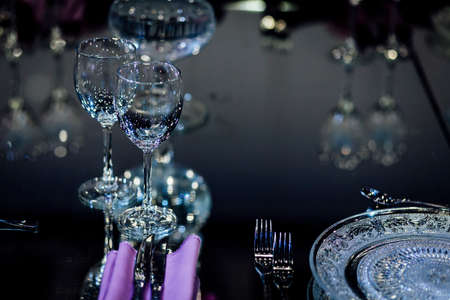 Luxury table settings for fine dining with and glassware, beautiful blurred  background. For events, weddings.の写真素材