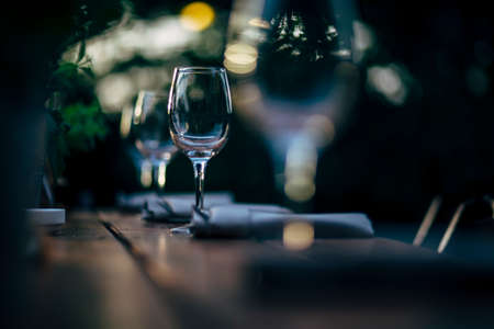 Luxury table settings for fine dining with and glassware, beautiful blurred  background. For events, weddings and other social events.の写真素材