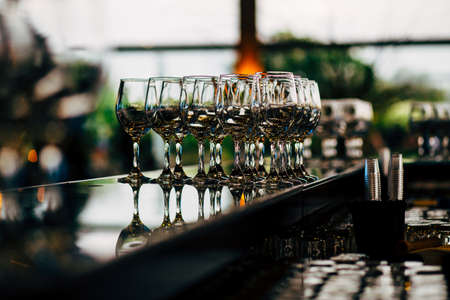 Luxury table settings for fine dining with and glassware, beautiful blurred  background. For events, weddings. WEDDINGS, Wedding detals and planing.の写真素材