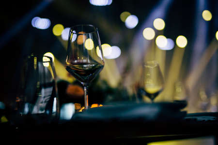 Luxury table settings for fine dining with and glassware, beautiful blurred  background. For events, weddings. WEDDINGS, Wedding detals and planing.の写真素材