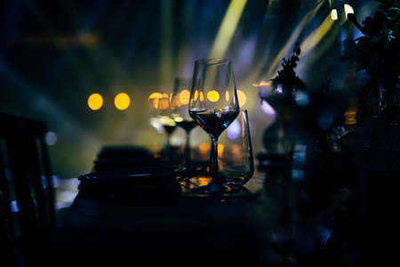 Luxury table settings for fine dining with and glassware, beautiful blurred  background. For events, weddings. WEDDINGS, Wedding detals and planing.の写真素材