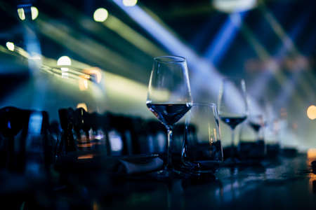 Luxury table settings for fine dining with and glassware, beautiful blurred  background. For events, weddings. WEDDINGS, Wedding detals and planing.の写真素材
