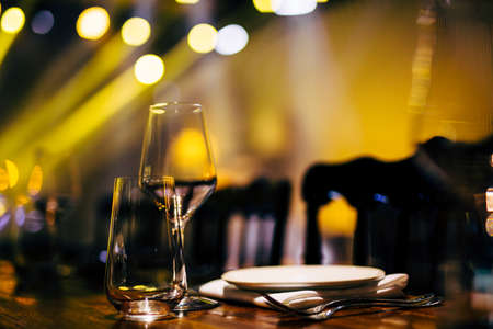 Luxury table settings for fine dining with and glassware, beautiful blurred  background. For events, weddings. WEDDINGS, Wedding detals and planing.の写真素材