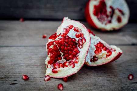 Fresh POMEGRANATE on wooden background.の写真素材