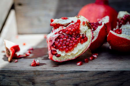 Fresh POMEGRANATE on wooden background.の写真素材