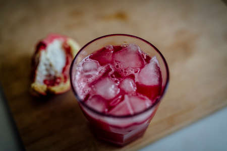 Fresh POMEGRANATE on wooden background.の写真素材