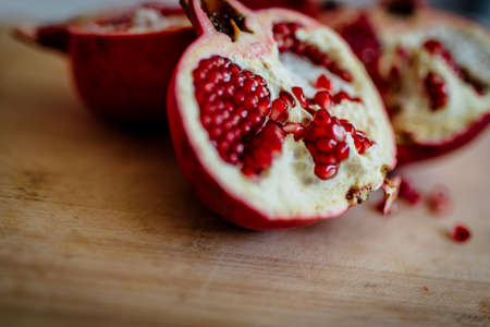 Fresh POMEGRANATE on wooden background.の写真素材