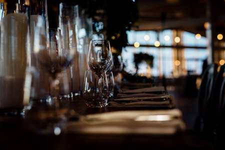 Luxury table settings for fine dining with and glassware, beautiful blurred  background.の写真素材
