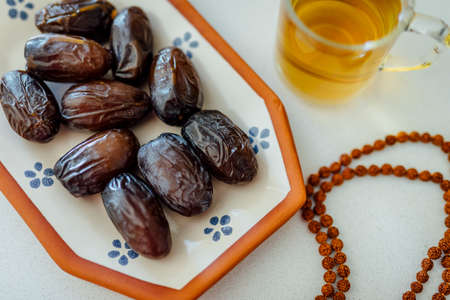 Elegant and Beautiful settings for ramadan holidays in islamic culture  
Ramadan also known as Ramzan Ramadhan Ramathan with herb tea and Prayer beads.の写真素材